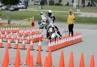 Officer Donnie Williams tears up the course at the Grand Prairie Police Motorcyc