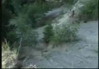 Mountain Biker Jumps Off Cliff