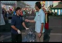 Reporter Breaks Ice Sculpture